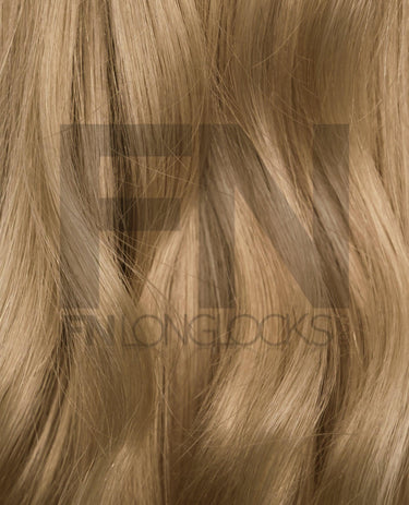 Luxury human remy hair extensions in natural blonde, showcasing smooth, silky texture and natural shine.