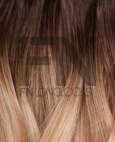 Luxury human hair extensions with smooth, blended brown to blonde ombre strands