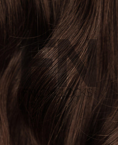Luxury human remy hair extensions with smooth, natural brown strands for seamless blending