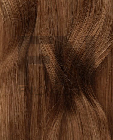 Luxury real human remy hair extensions with smooth, natural brown strands for seamless styling.