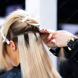 Tape-in hair extension application.