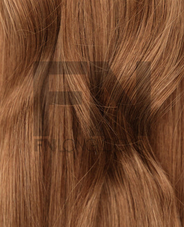 Smooth, natural-looking human hair extensions in rich brown tones
