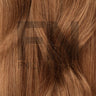 Luxury human remy hair extensions in rich brown tone, showcasing smooth texture and natural shine for seamless blending.