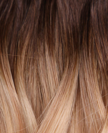Model showing dimensional blend of FNLonglocks rooted 4/18 tape-in hair extensions.