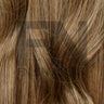 Luxury human remy hair extensions with natural brown tones and smooth texture for seamless blending.