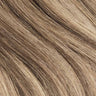 Smooth, blended brown and blonde human hair extensions with natural highlights