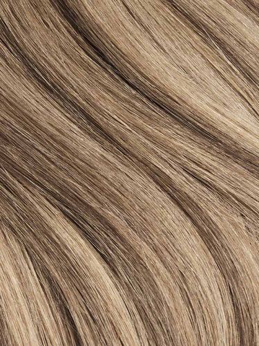 Smooth, blended brown and blonde human hair extensions with natural highlights