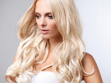 Model wearing FNLonglocks Color 60 lightest blonde remy hair extensions