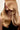 Luxury blonde hair extensions with smooth, voluminous waves for a glamorous look
