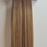 Tape hair extensions in rooted in 4/8 shade