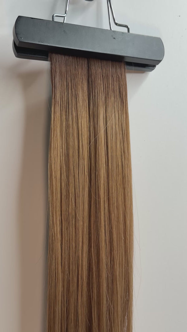 Tape hair extensions in rooted in 4/8 shade